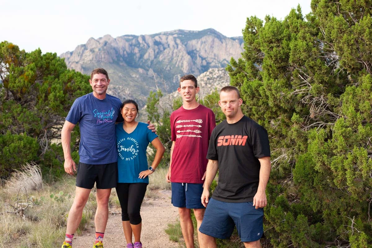 Adam Trubow (left) and his Leadville 100 crew, including his two pacers, Bella Siefert (second from left) and Tim Harris (far right).